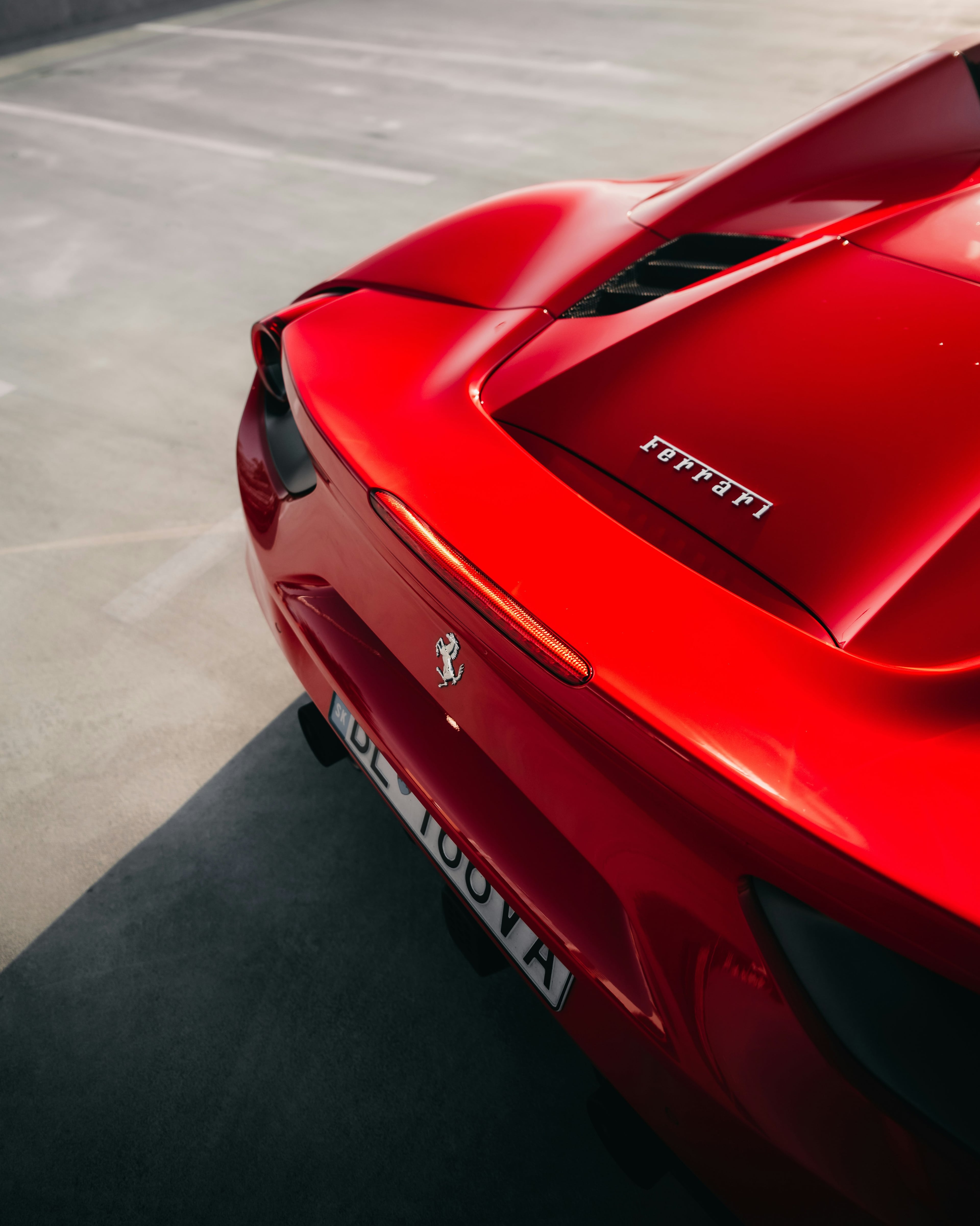 Rear of a red Ferrari with the prancing horse badge